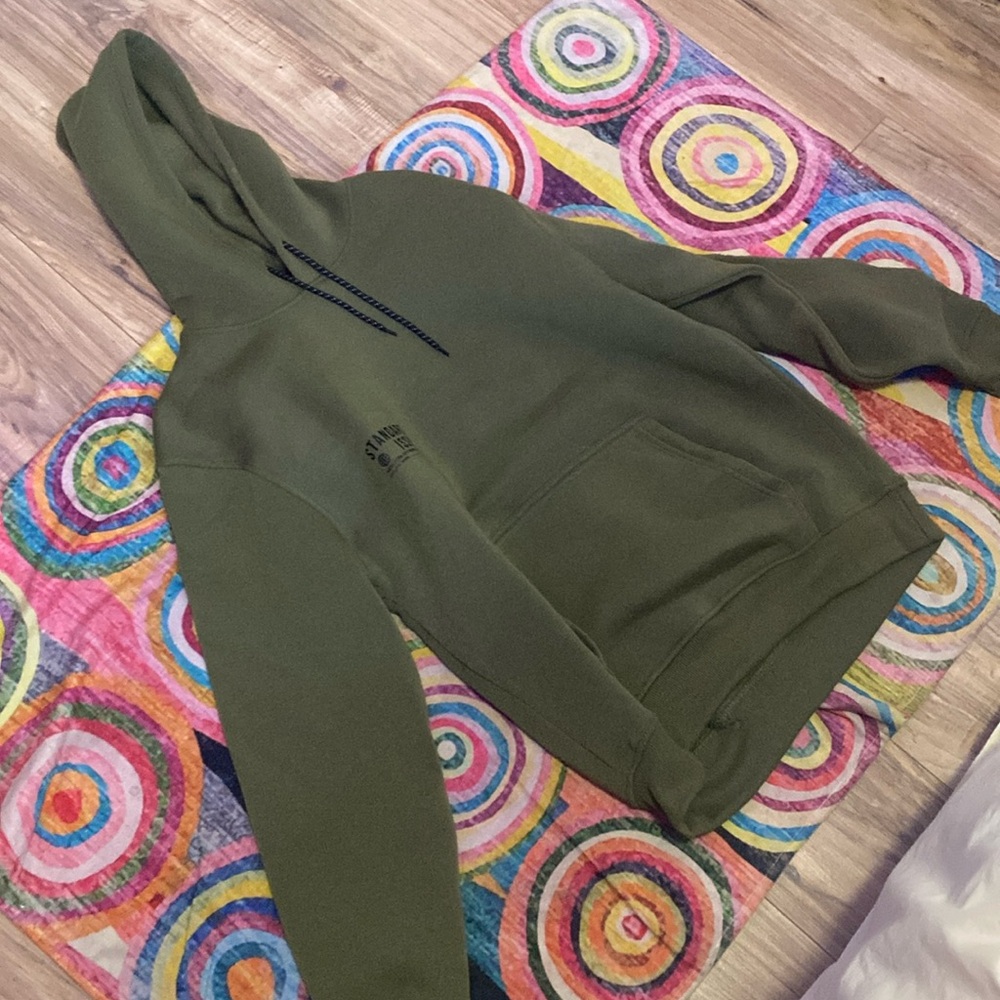 Green hoodie from a brand from New York call standard issue